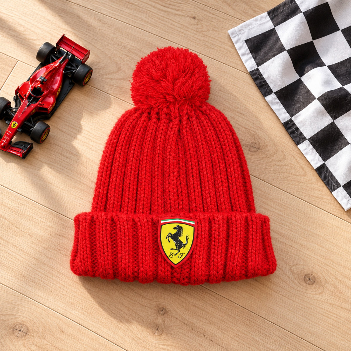 Dziecięca czapka z pomponem Ferrari z logo – zdjęcie poglądowe (AI)