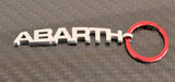 Brelok Abarth metalowy z czerwonym kółkiem, produkt oficjalny
